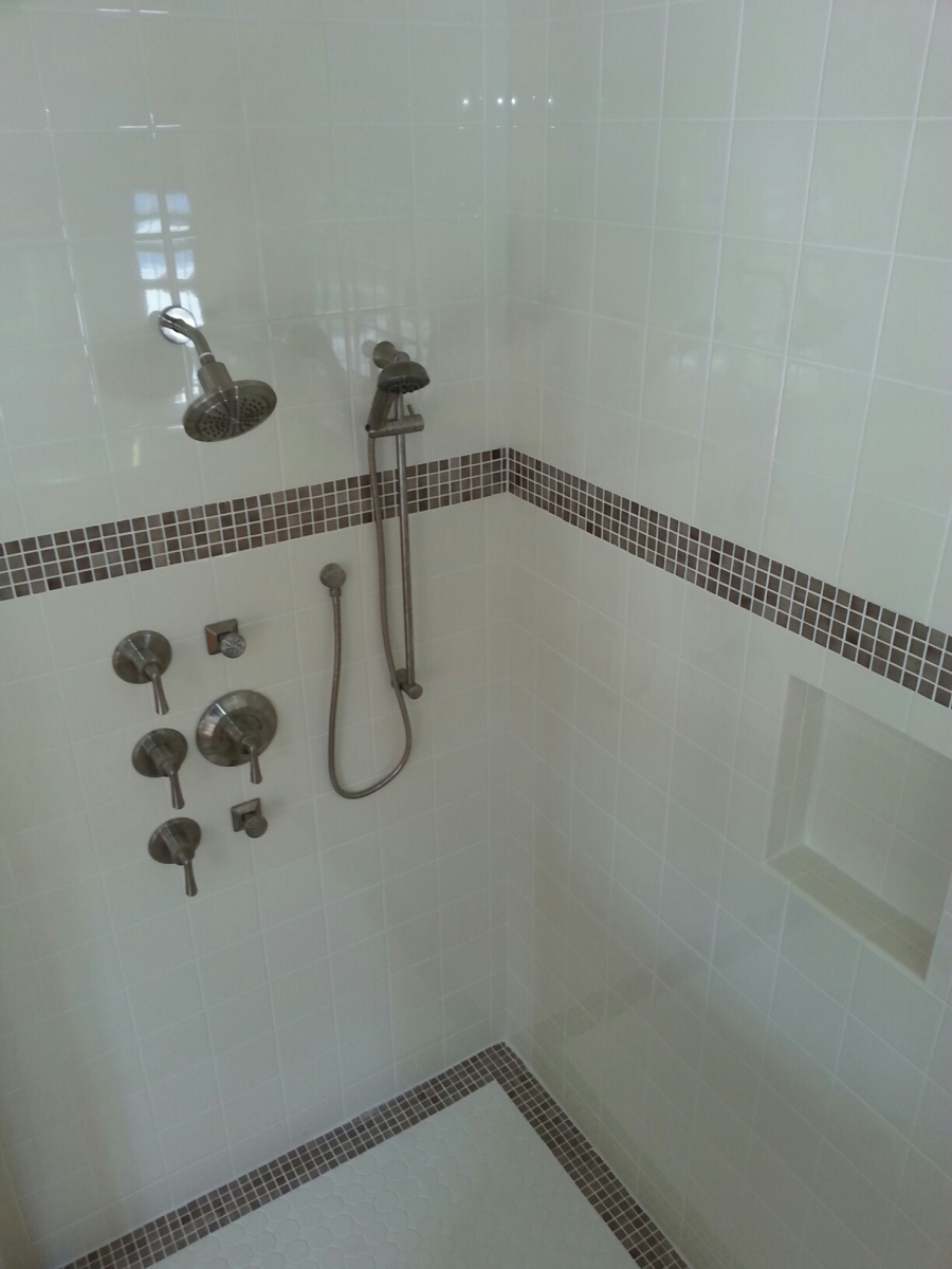 Curbless tiled walk-in shower built for accessibility by STW Home Remodeling