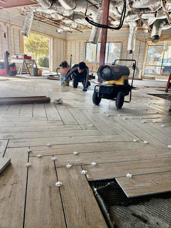 Herringbone tile floor installed during a commercial restaurant remodel