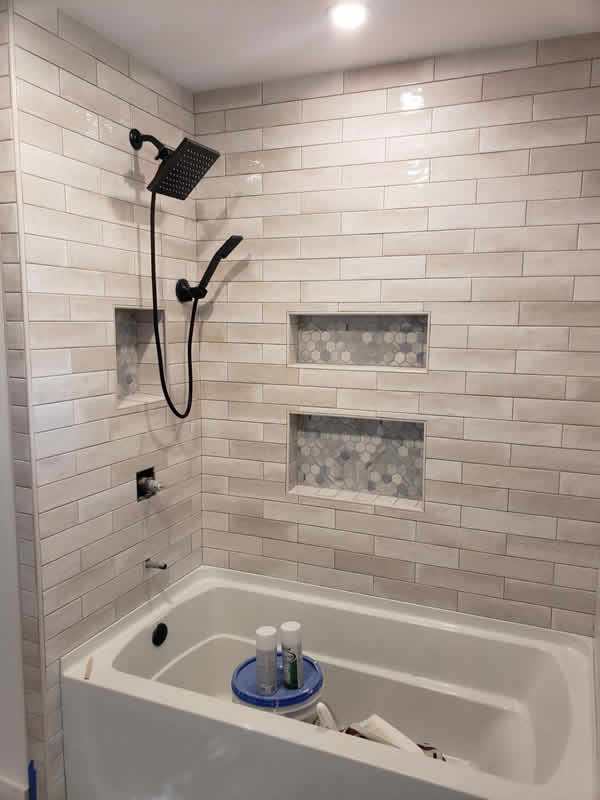 Beige glossy subway tile shower